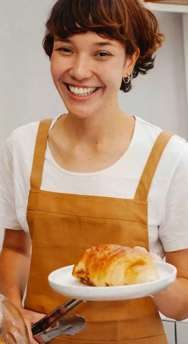 happy waitress with a croissant, real interactions